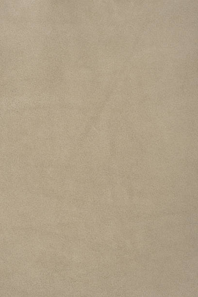 istock Beige suede background as a material for designers. Suede texture. 2192554530