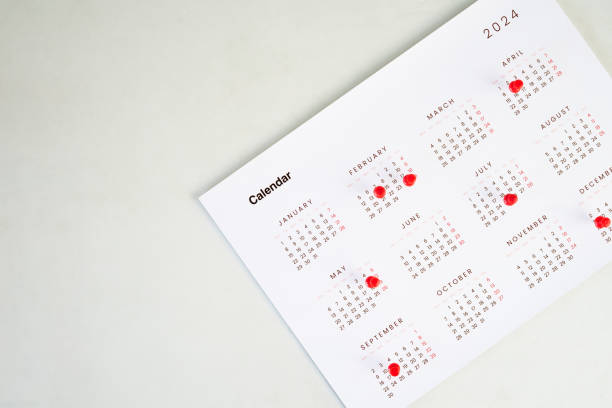 istock Calendar sheet with pin on the table 2192555487
