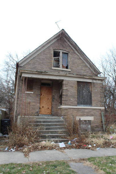 istock Abandoned brick home in Englewood with trash in front of it 2192564625