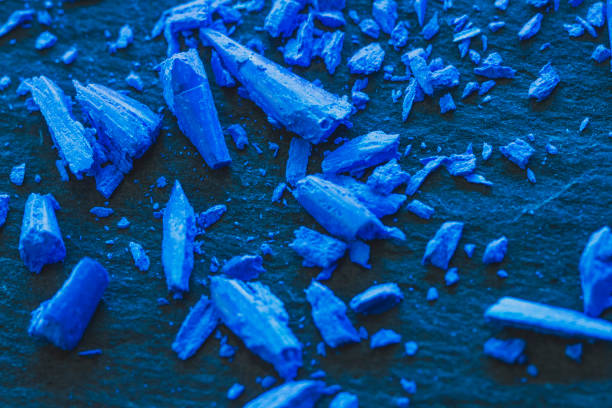 Rusty metal surface with peeling paint. This photo illustrates the concept of aging and material deterioration in outdoor industrial objects. Background for designer, copy space