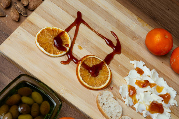 Butter board with caramel and orange chips shaped like a bicycle