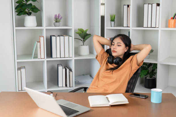 istock Stressed Young Woman Struggling with Homework at Home After School in a Modern Study Environment 2192576628