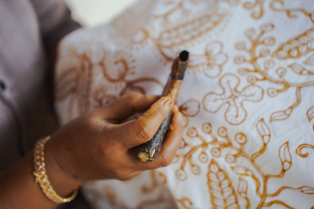 The process of making Indonesian batik with Lasem batik motifs. Making batik, making hand-drawn batik on white cloth