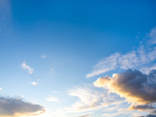istock Beautiful scene of white cloud with warm sunlight on clear blue sky background, horizontal style. Cloudy fluffy clouds floating scattered and blowing with the nature wind on the horizon sky. 2192587990