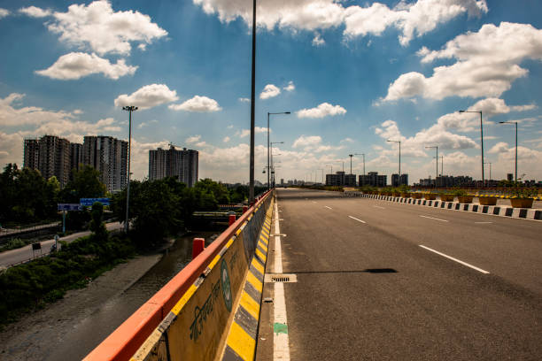 istock Urban Road Beneath a Bright Cloudy Sky 2192594772