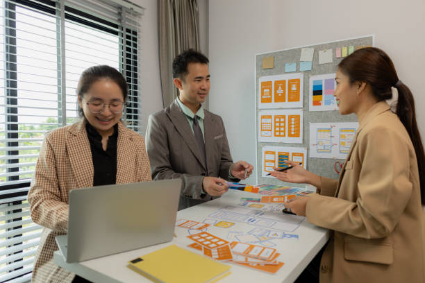 istock The web design team is consulting to exchange ideas on how to develop digital products that are modern and user-friendly, suitable for today's users, ux ui team 2192596357