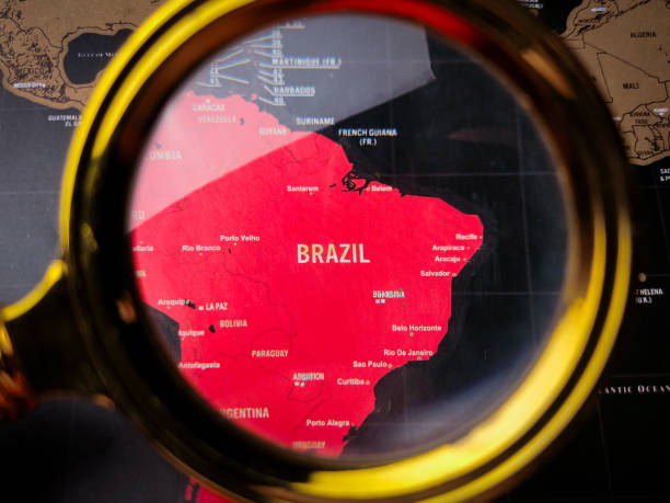 istock Closeup magnifying glass and focus to BRAZIL map 2192597288