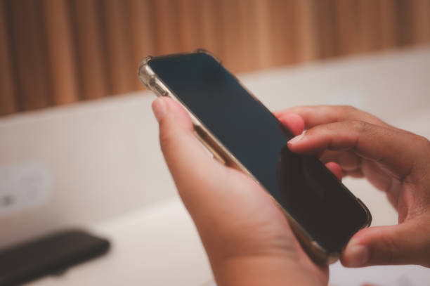 istock Social media marketing concept. man hand using smartphone typing, chatting conversation in chat box icons pop up typing on a phone for communication search networking and texting on a mobile app 2192599644