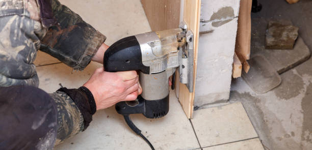 istock A man is using a power tool to cut a piece of wood 2192600215