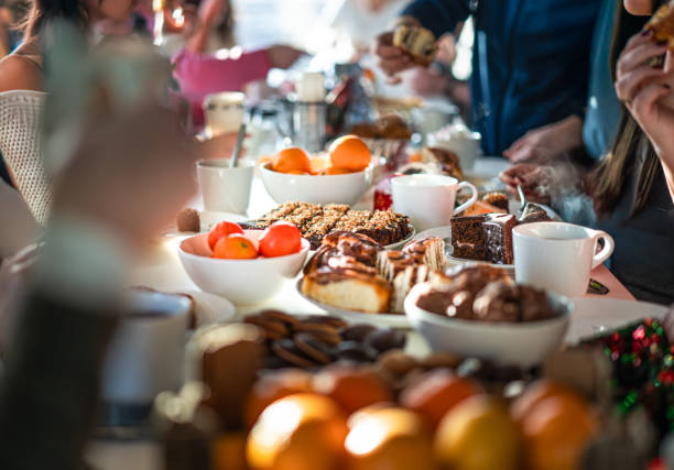 office celebration lunch table with food - ontbijt stockfoto's en -beelden