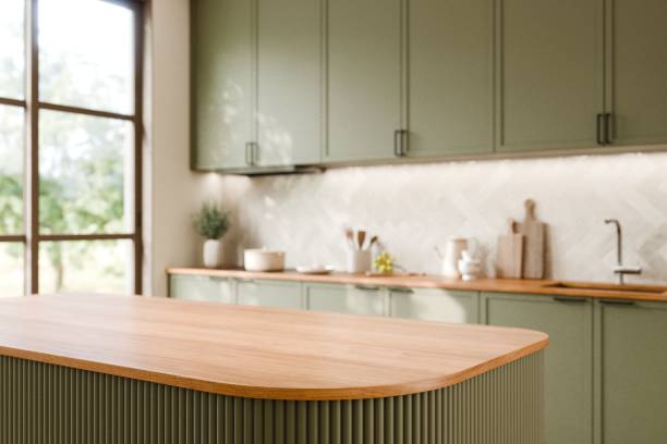 istock Modern Green Kitchen with Wooden Countertop design. Stylish modern kitchen featuring green cabinetry. 3d render. 2192608676