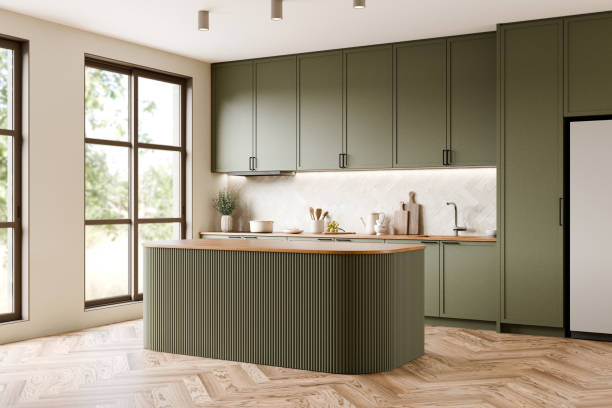 istock Modern kitchen design with green cabinets, large island, and bright atmosphere that complements modern living. 3d render. 2192608699