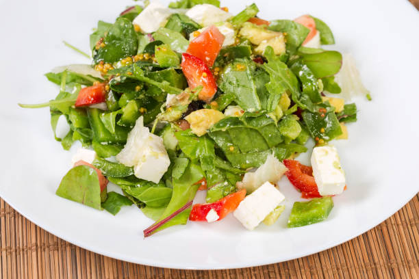 istock Salad of mozzarella and fresh vegetables, leaf lettuce, close-up 2192609990