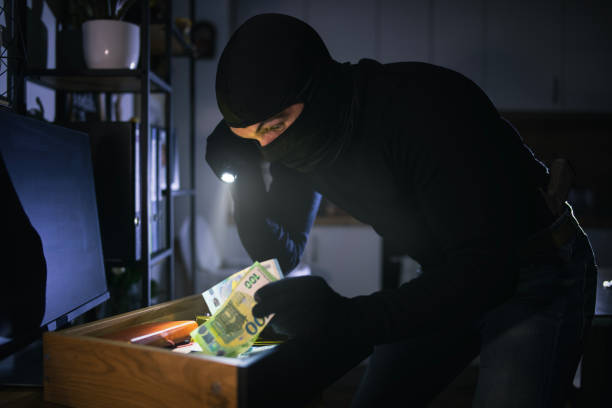 istock Thief with mask breaks into the house. 2192613161