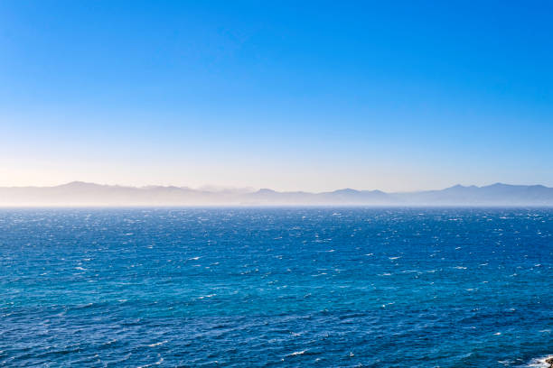 The Moroccan coast seen from Tarifa, in Spain, beyond the Strait of Gibraltar that connects the Atlantic Ocean to the Mediterranean Sea, and separates Africa from Europe