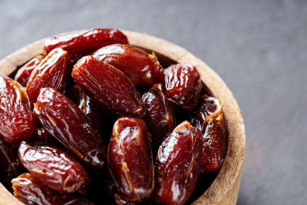 istock Organic Dried Dates in Rustic Wooden Bowl, Ramadan and Middle Eastern Cuisine 2192613602
