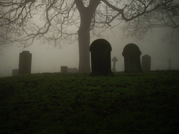 istock Eerie Graveyard in thick fog and mist 2192615689