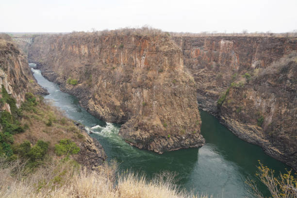 The Zambezi River flows into Victoria Falls between Zambia and Zimbabwe