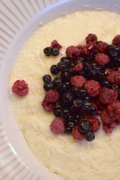 Blueberries and raspberries on top of semolina breakfast porridge