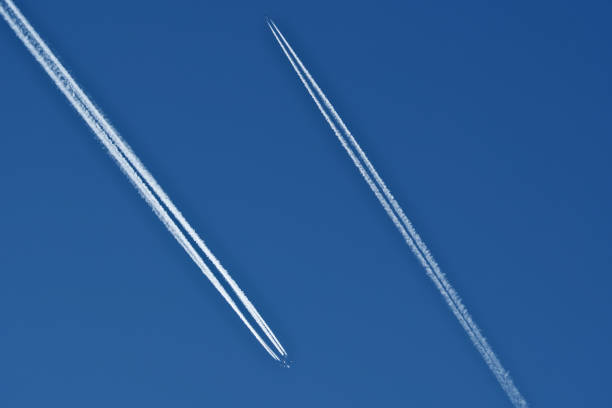 vapor trails and passenger jets high in the sky