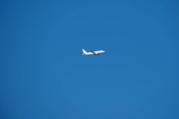 Rome, Italy, July 18, 2021: Emirates Airbus A380-800 aircraft flies in a blue cloudy sky. The largest twin-engine commercial aircraft in the world lands at the Fumicino International Airport.