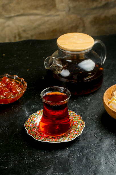 istock Traditional tea set with sweet treats on a rustic table 2192619444