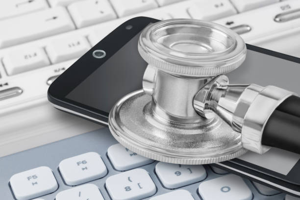 istock Medicine online with mobile, stethoscope and PC keyboard close up 2192620221