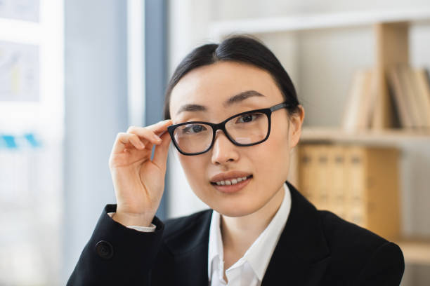 istock Confident Asian businesswoman portrait in modern office setting 2192621749