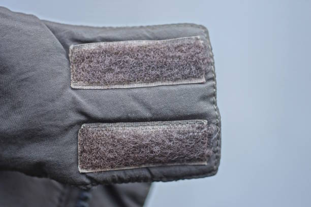 istock gray long plastic velcro fasteners on green fabric jacket collar 2192624402