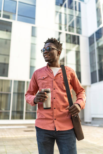 istock Handsome young man is having his coffee to go 2192633380