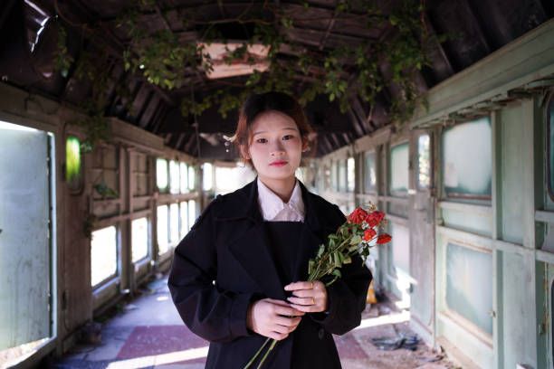Young man holding dried flowers