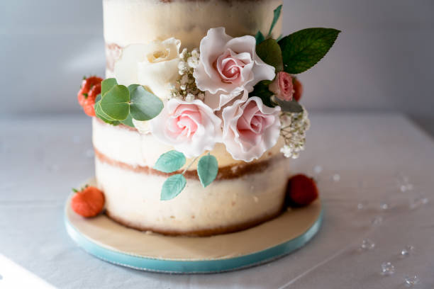 istock Sponge wedding cake with pink flowers 2192635279