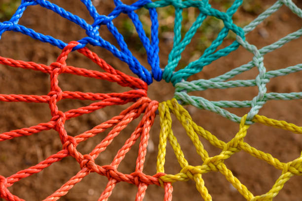 A colorful web of ropes showcases a stunning blend of artistry and craftsmanship outdoors.