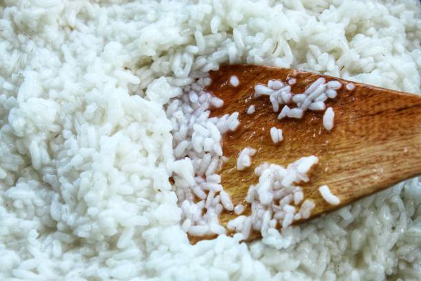 istock texture and background of wet white rice close up 2192642445