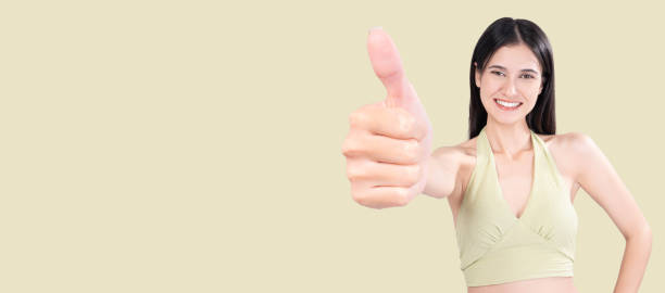istock Cheerful Woman Giving Thumbs Up 2192644053