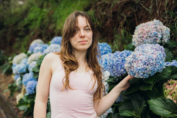istock Attractive Girl in the Tropical Forest with Hydrangea Flowers 2192644063