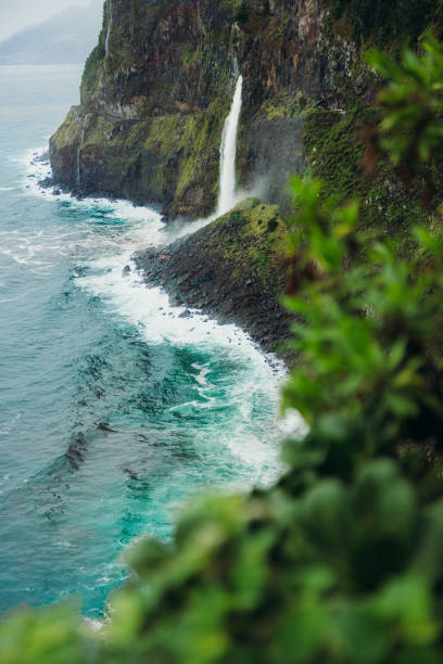 istock Scenic Waterfall In Tropical Island Falling into Ocean 2192644846