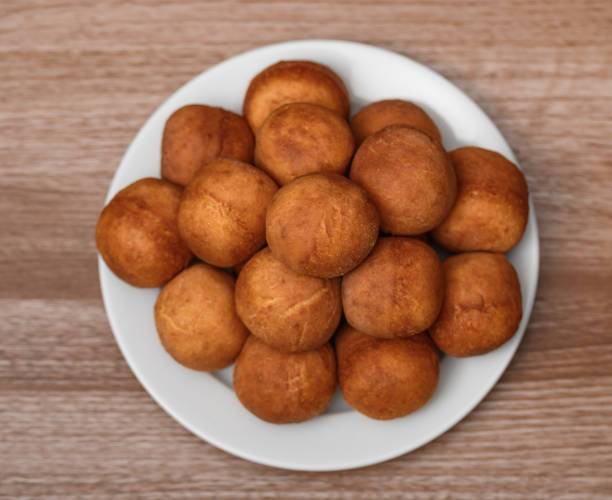 istock Sweet golden mini cheese donuts beautifully arranged on a plate 2192645743