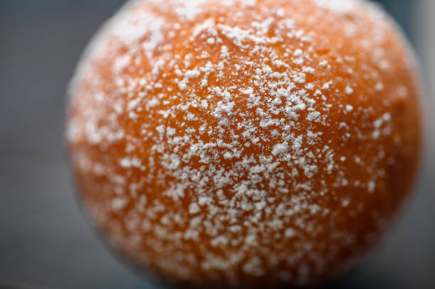 Macro close-up of white powdered sugar on a donut