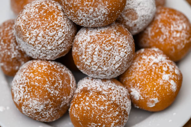 istock Traditional doughnuts with powdered sugar, Fat Thursday, fried yeast rolls with filling, 2192645929
