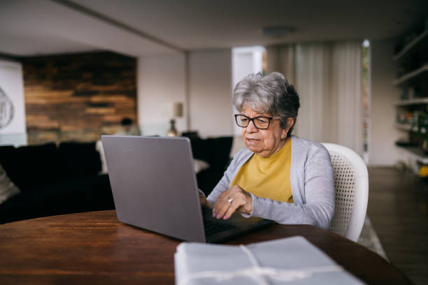 istock Senior woman using laptop at the desk 2192649812