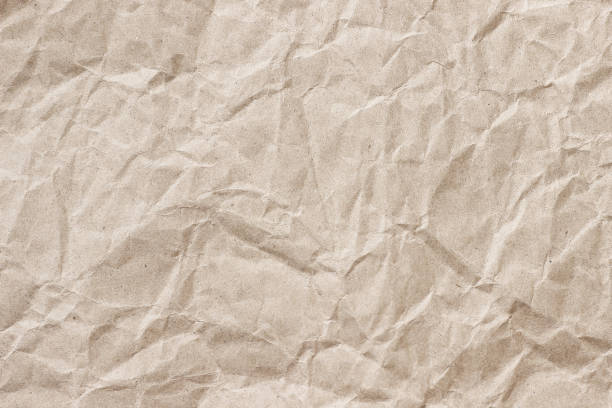 istock Crumpled craft beige paper background 2192650593