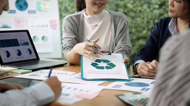 istock Carbon offset price report CO2 emission. Future growth Net zero waste in ESG ethical SME office protect climate change global warming social issues project. Group of asia people Eco friendly SDGs plan 2192652187