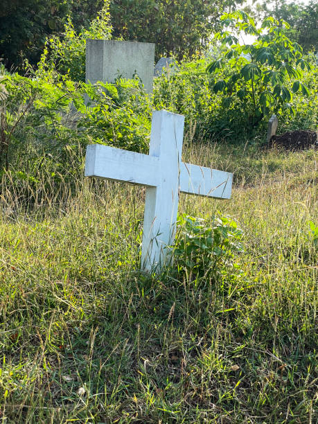 istock White Cross in the old grave 2192653995