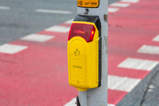 istock Pedestrian crossing signal button in a rainy urban environment 2192654117