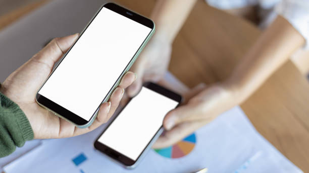 istock Payment or cashless technology concept, Hand using mobile phone application to scan, Hands holding mobile phone, Coffee shop accepting digital pay without money, Phone screen blank. 2192656331