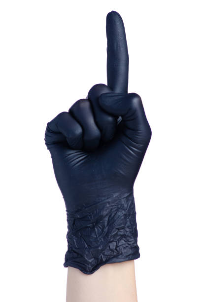 Female hand in black glove pointing finger up on white background isolated