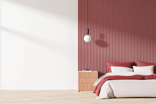 istock Minimalist bedroom interior with red accents and modern lighting. 3D Rendering 2192656811
