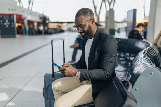 istock Businessman using smartphone while waiting at the airport 2192657487