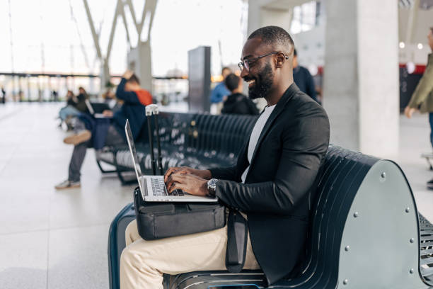 istock Businessman working on laptop while waiting at the airport 2192657493